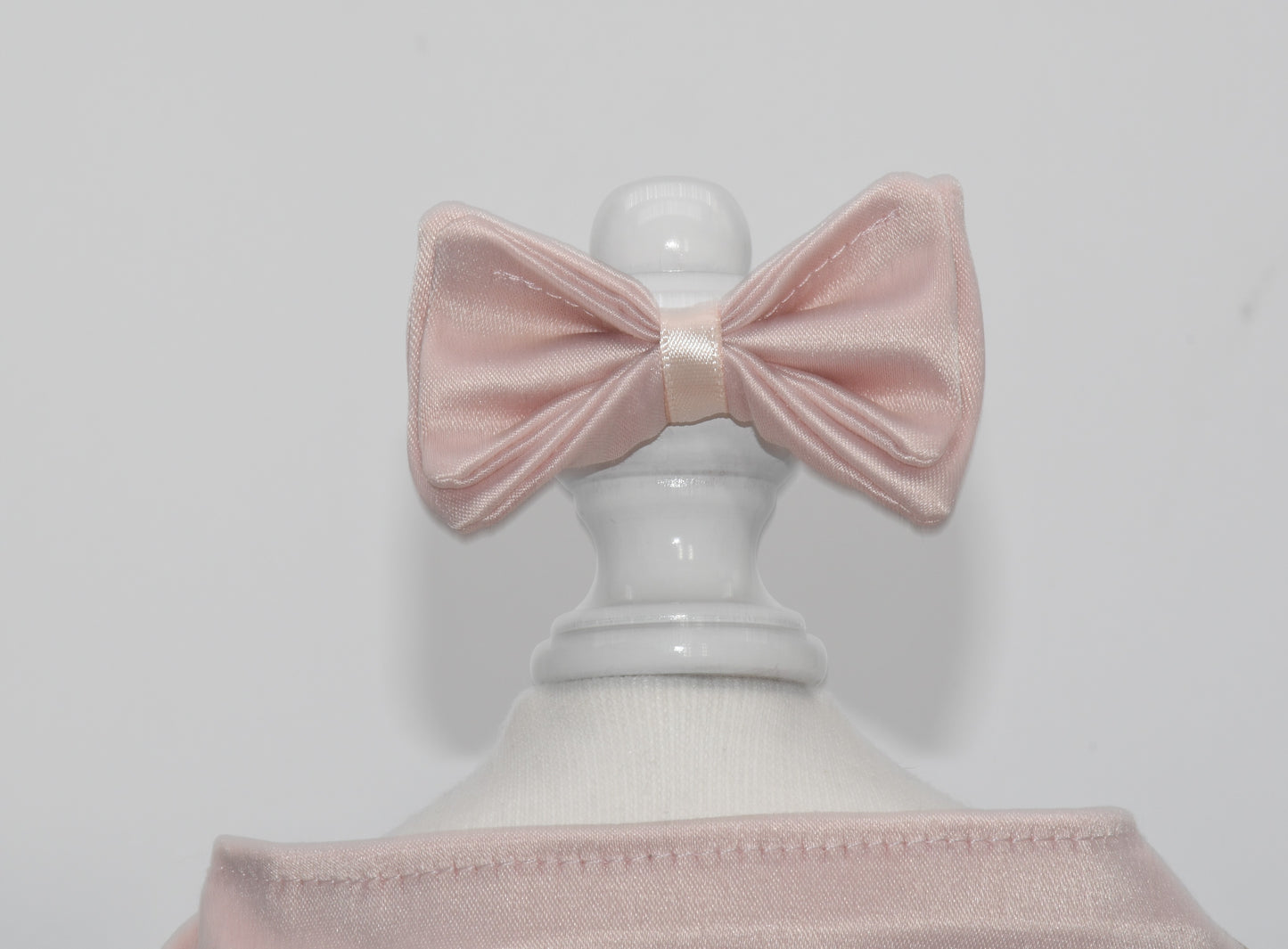 The pet hair bow is on a dress form