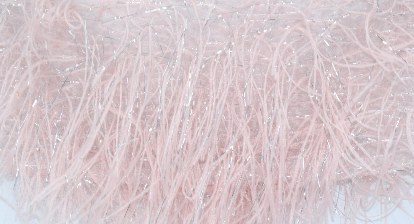A closeup on the feather look skirt