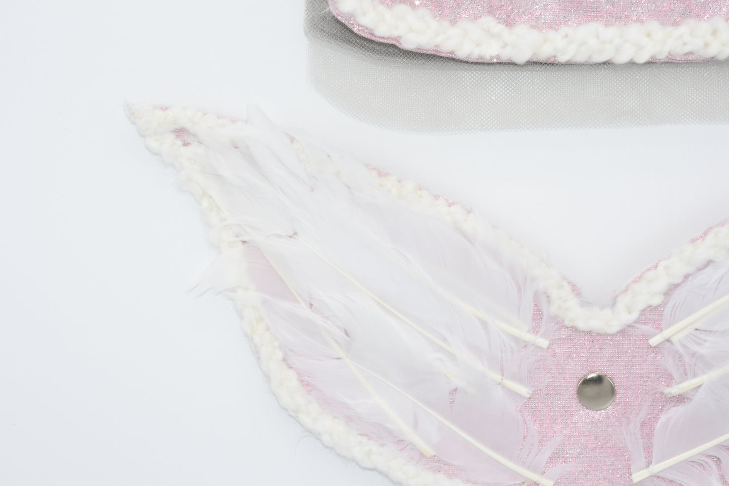 You can see the wing details and feather embroidery on pet dress