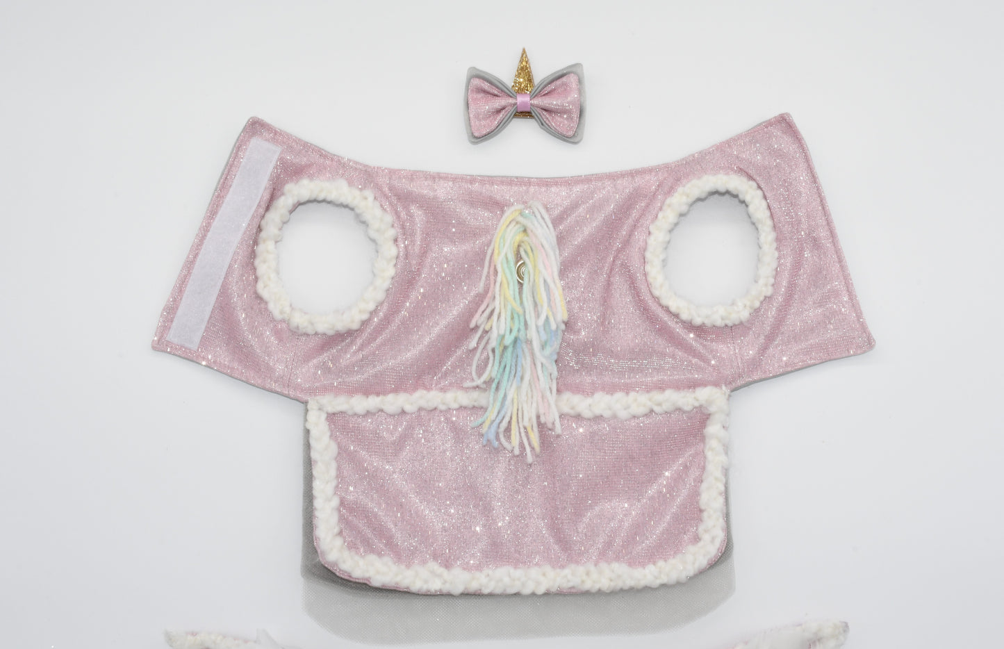 A picture showing the unicorn pet costume and hair bow