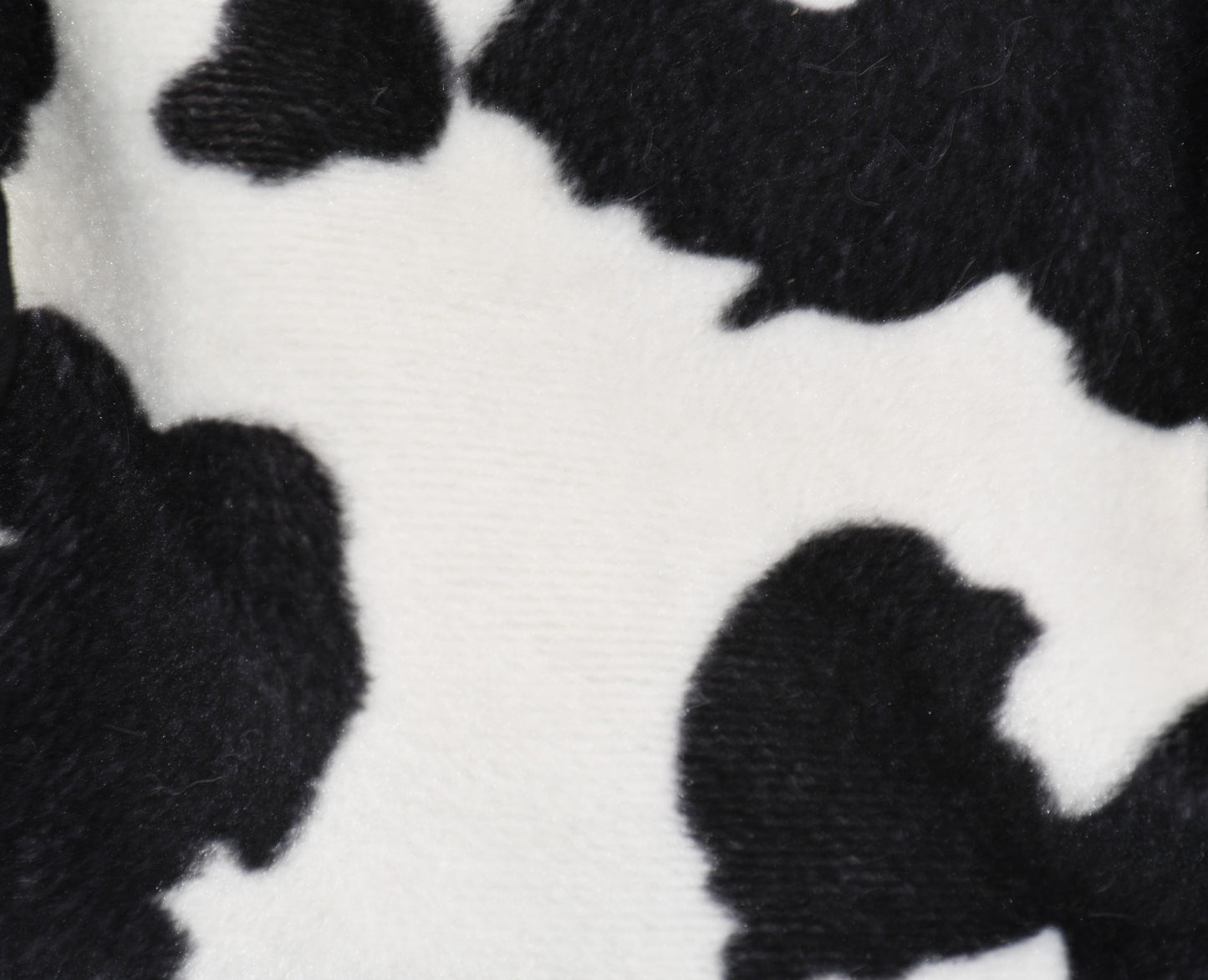 a close up on the faux fir cow fabric