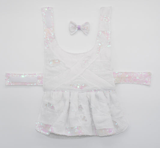 a view of the entire dress and pet hair bow