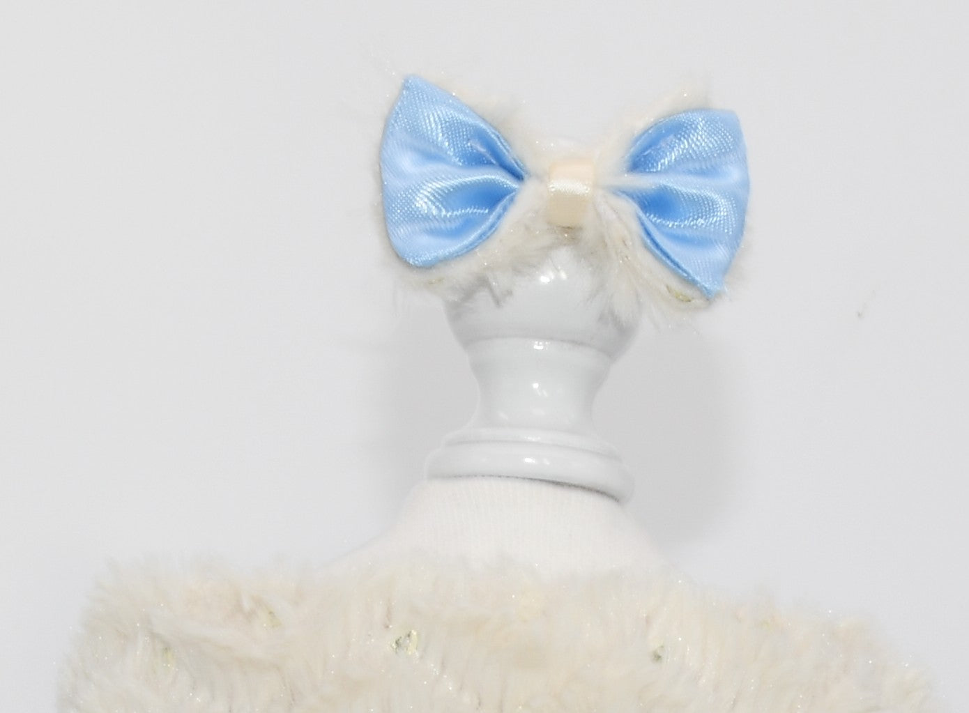 The pet hair bow is on a dress form