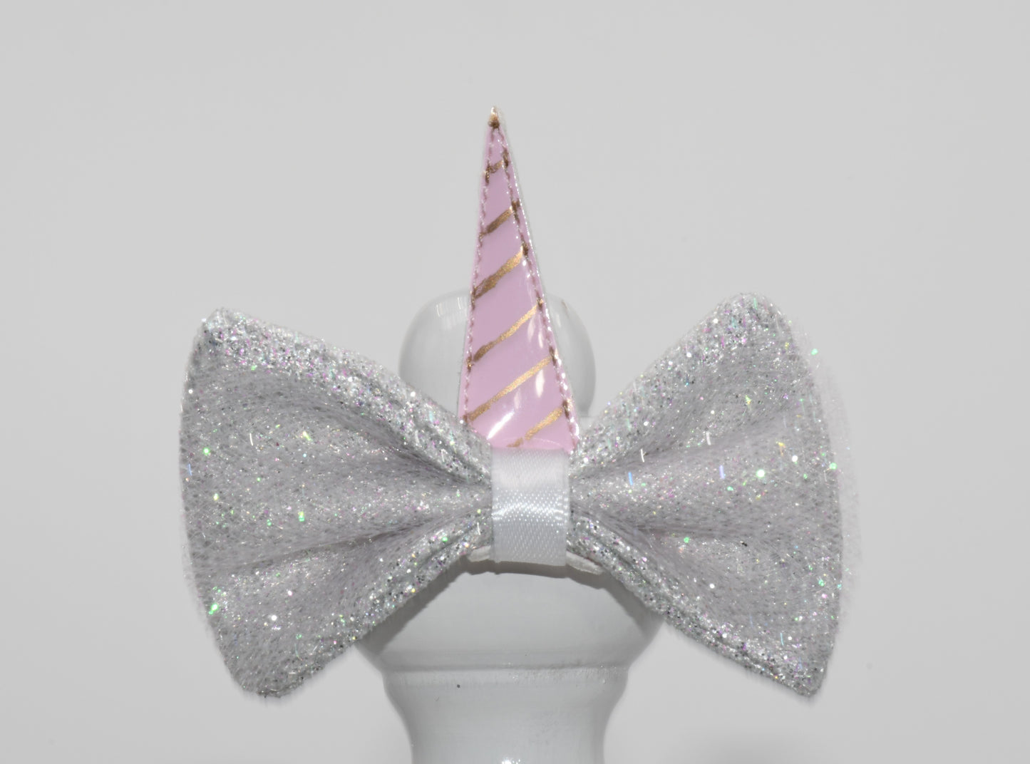 a close up on unicorn pet hair bow