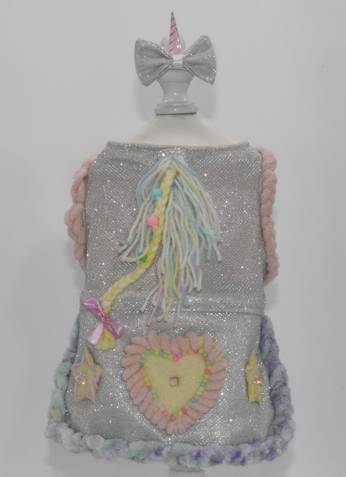 a back view of the dress in a dress form