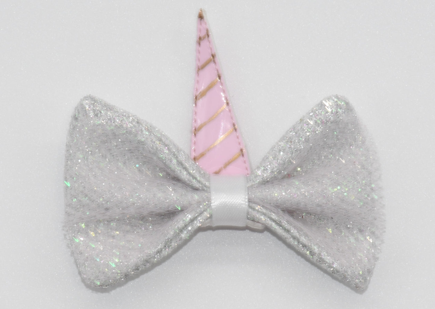 a close look at pet hair bow with unicorn horn