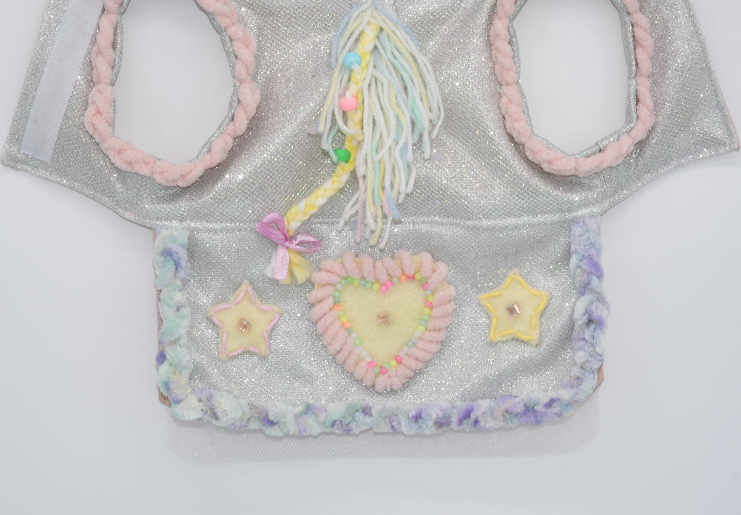 a view of the detailed and hand embroidered skirt and mane