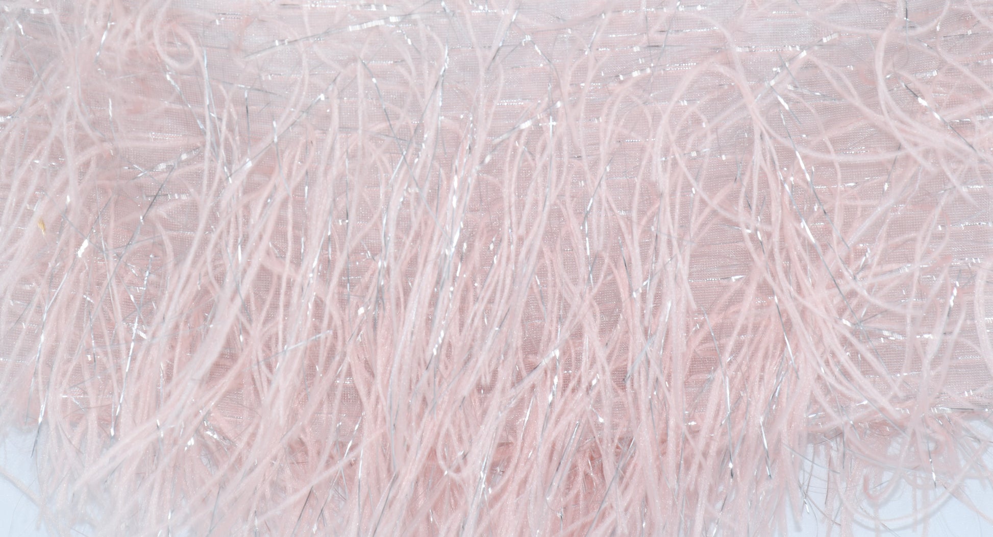 A closeup on the feather look skirt
