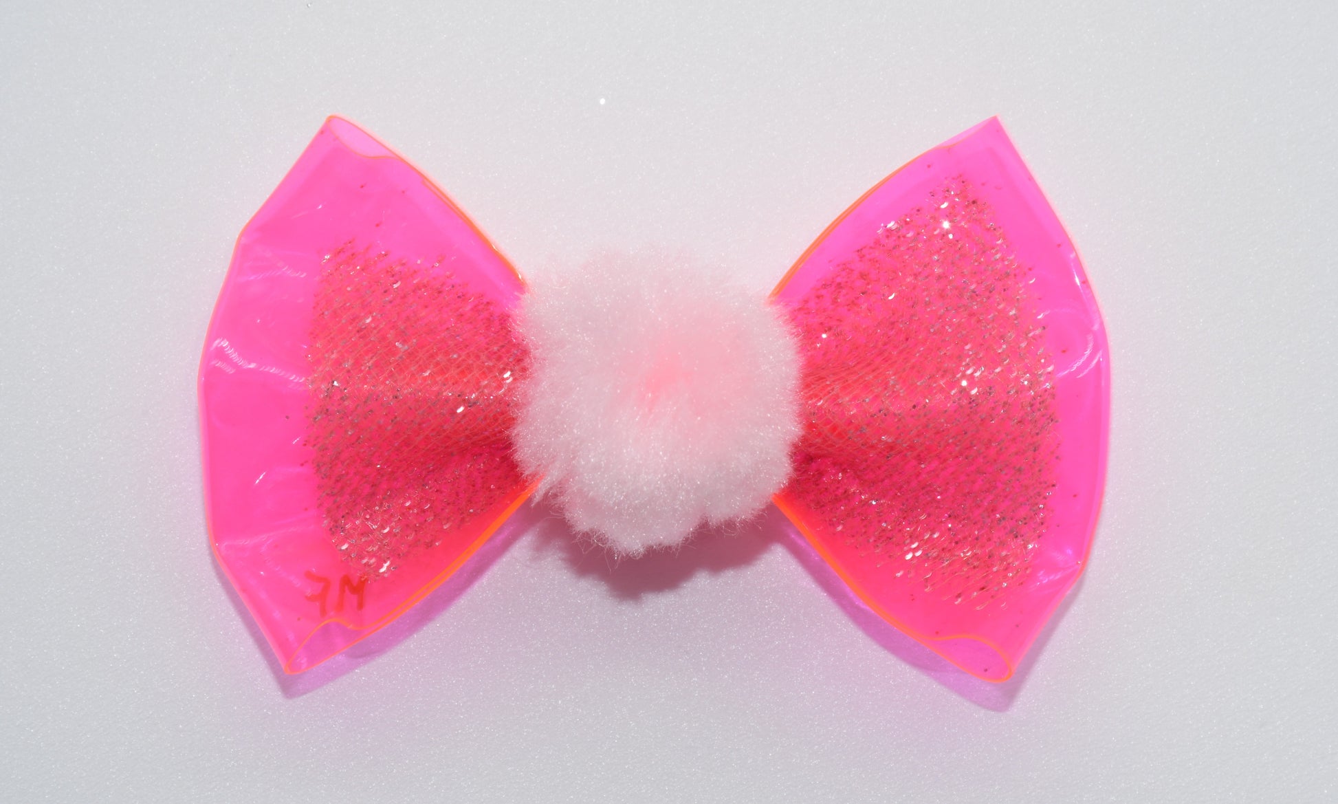 a pink vinyl pet hair bow