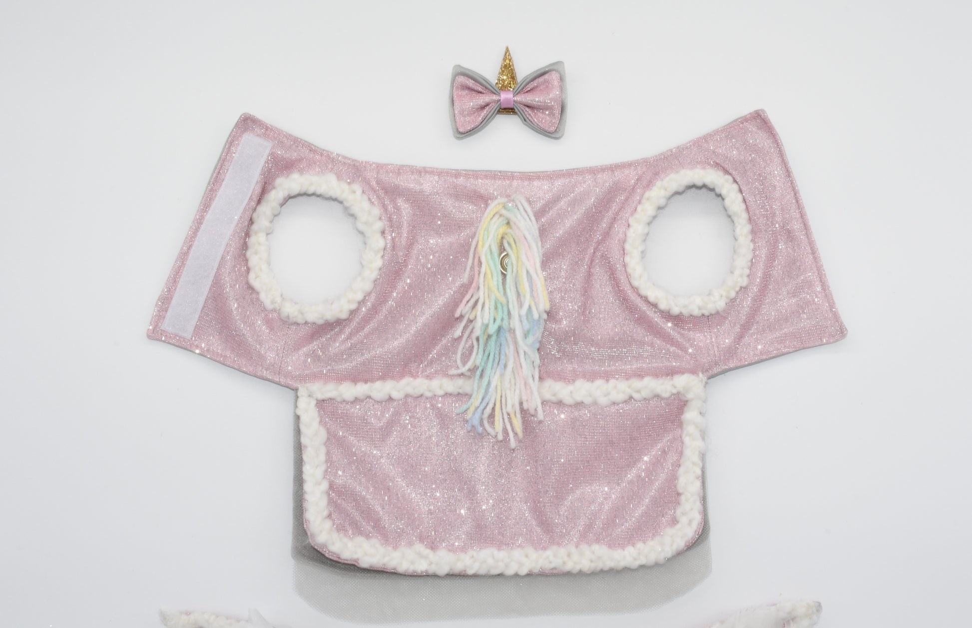 A picture showing the unicorn pet costume and hair bow