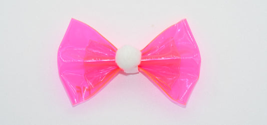a pink vinyl pet hairbow with pom pom 