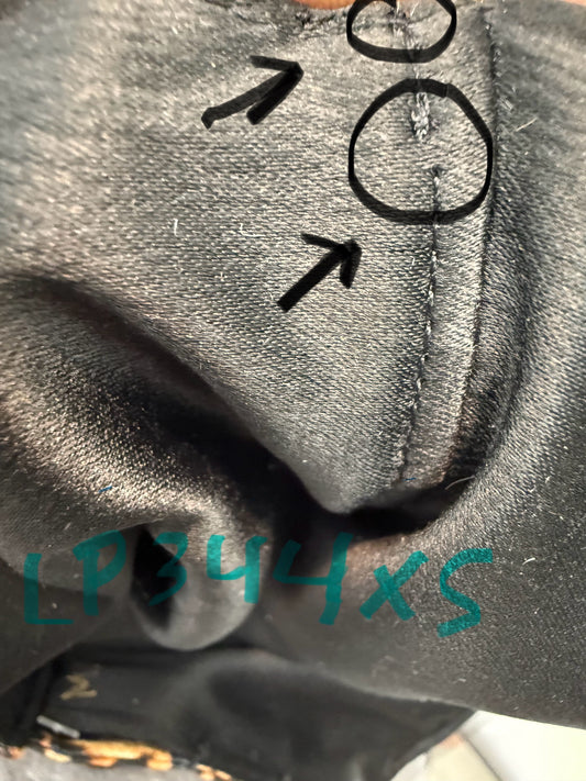 this picture is showing the imperfection in the top stitch. This is for the dog costume called Leopard Untamed Beauty Pet Dress.