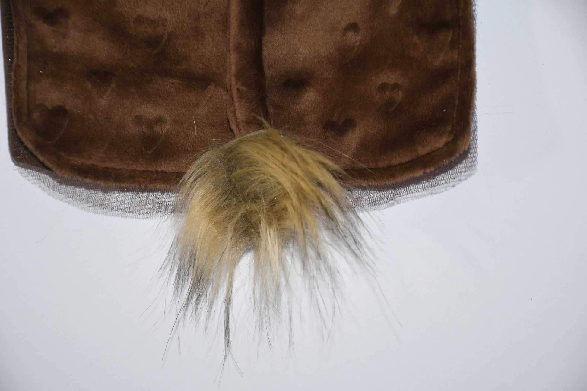 a tail with pom pom 