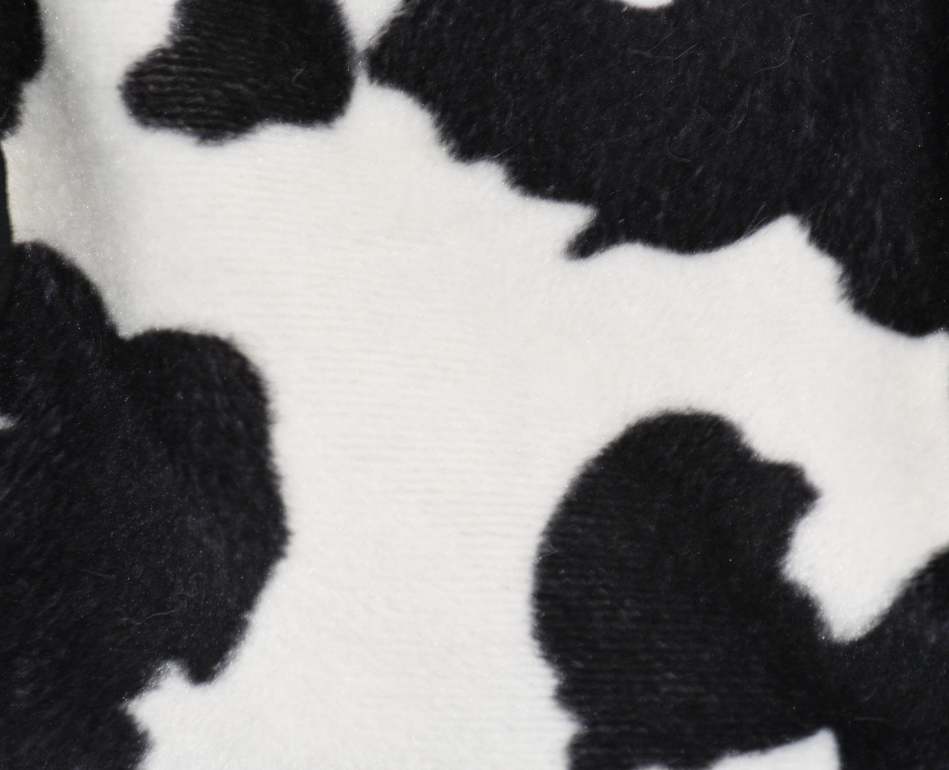 a close up on the faux fir cow fabric