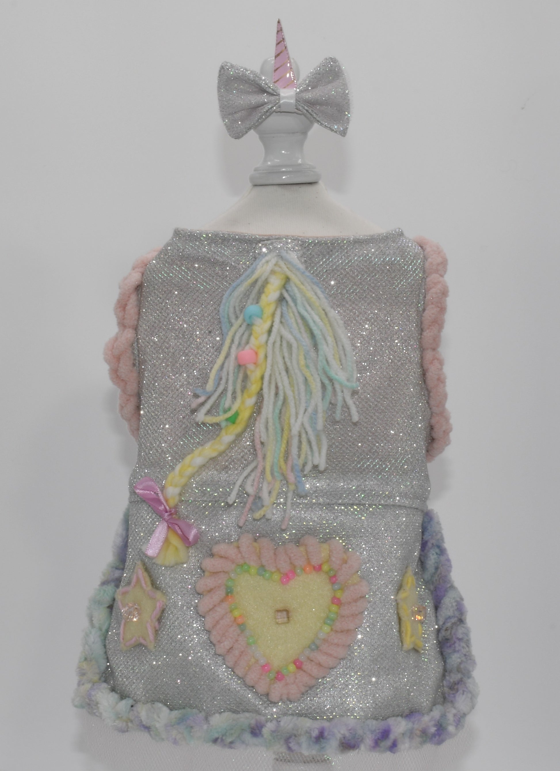 a back view of the dress in a dress form