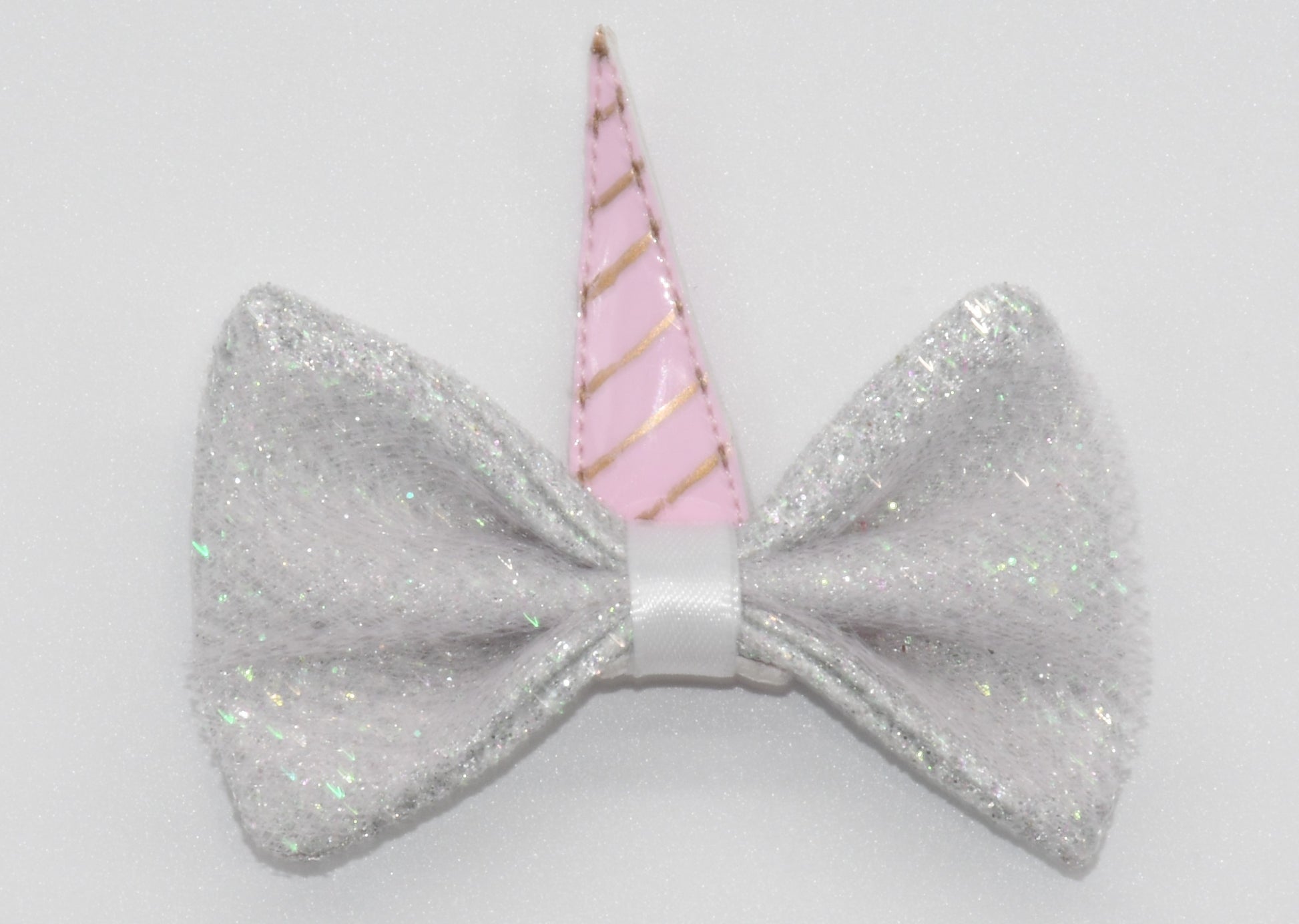 a close look at pet hair bow with unicorn horn
