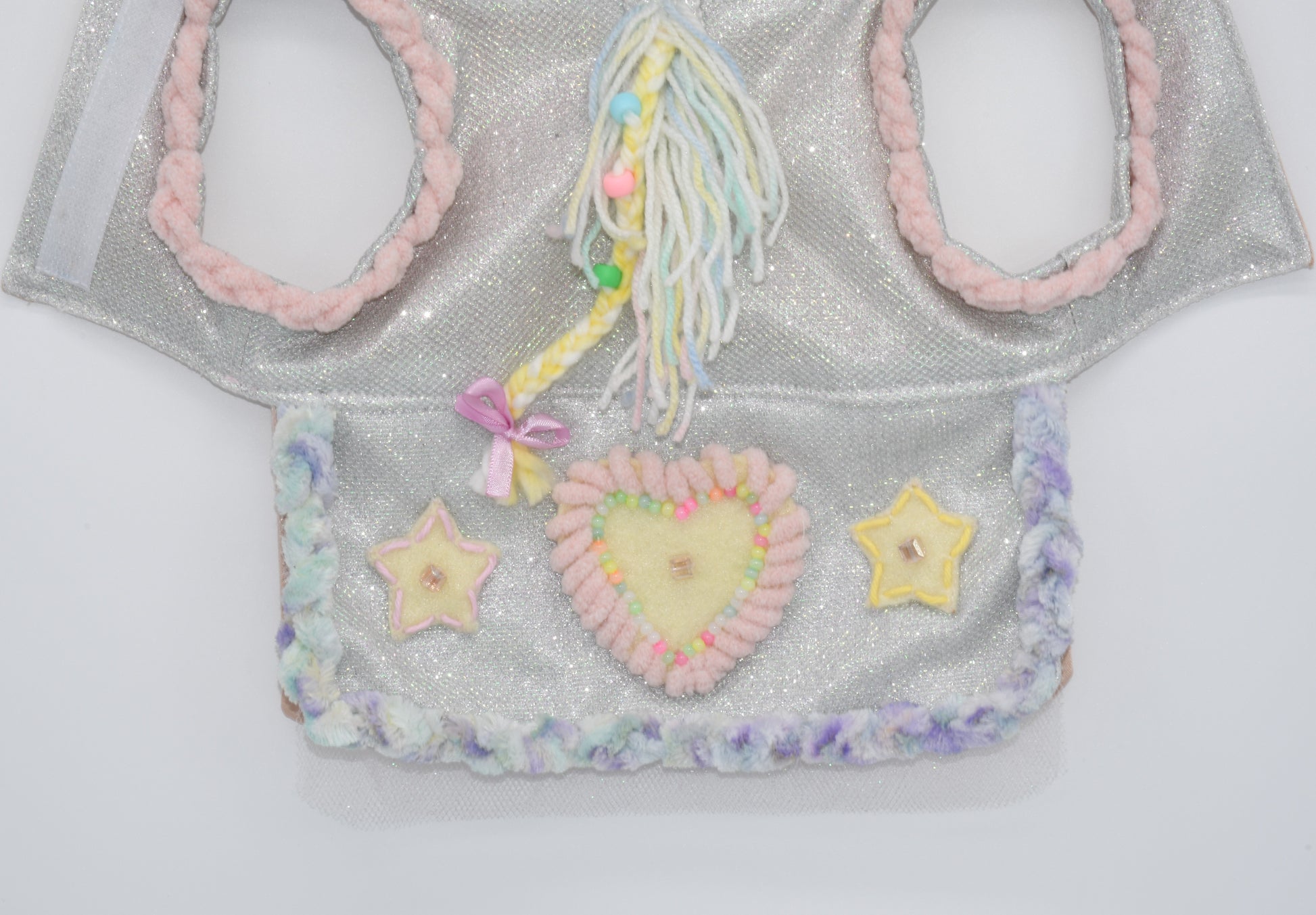 a view of the detailed and hand embroidered skirt and mane