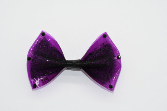 a view of the pet hairbow with black crystals. 