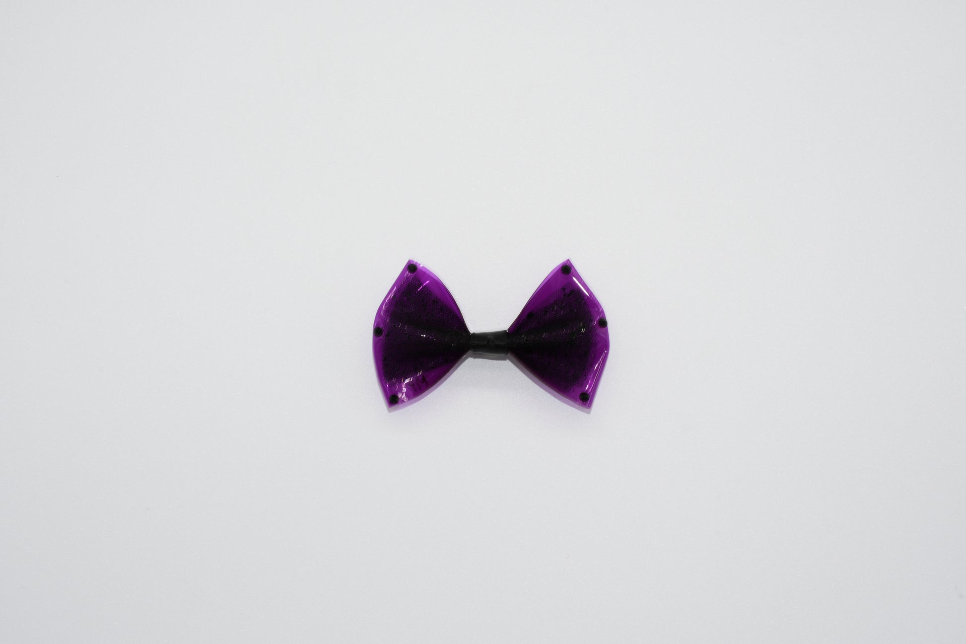 a view of the pet hairbow with black crystals. 